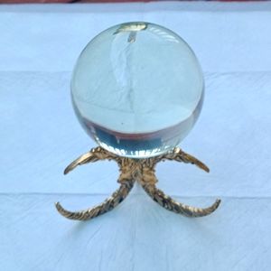 Clear crystal ball with brass moon stand